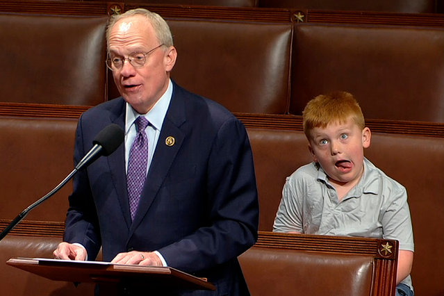 An image from House Television shows Republican John Rose speaking on the floor of the House of Representatives as his son Guy makes a face in Washington DC, US on June 4, 2024. (Photo by AP Photo)