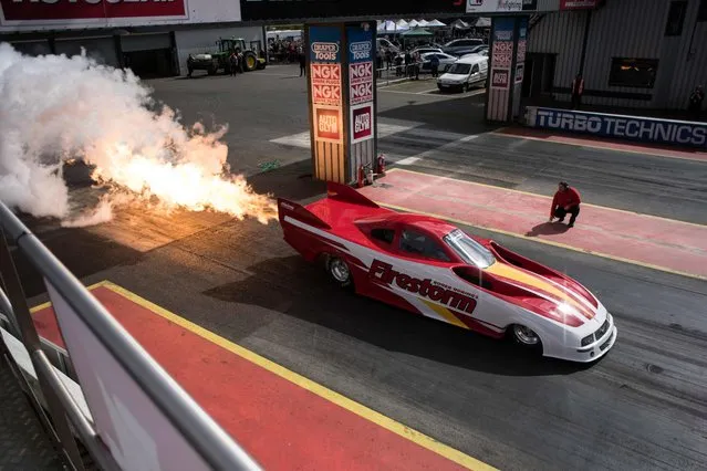 A jet- powered dragster prepares to take part in The Fast Show performance car event held at the Santa Pod Raceway near Wellingborough, central England on April 2, 2017. The annual Fast Show event features: automotive displays, a jet- powered dragster, stunt driving and amateur drag racing. (Photo by Oli Scarff/AFP Photo)