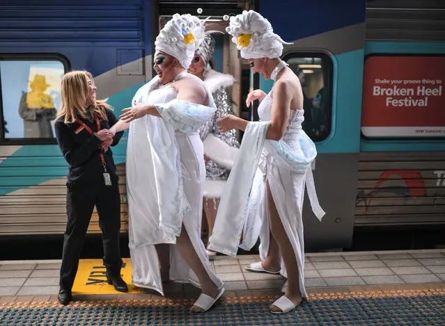 Drag queens Maude Boate, Anita Wiglit and Kita Mean pose for a photograph before boarding the NSW TrainLink Silver City Stiletto train at Central station in Sydney, Australia, 12 September 2019. Drag queens and kings will travel to the outback NSW town of Broken Hill to attend the annual Broken Heel festival, paying homage to the iconic Australian film “Priscilla, Queen of the Desert”. (Photo by James Gourley/AAP)