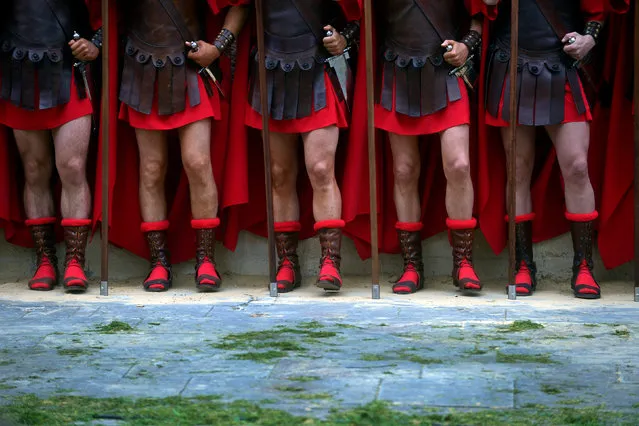 Locals dressed as Roman soldiers take part in a Via Crucis representation on Good Friday, in the Basque town of Balmaseda, northern Spain April 14, 2017. (Photo by Vincent West/Reuters)