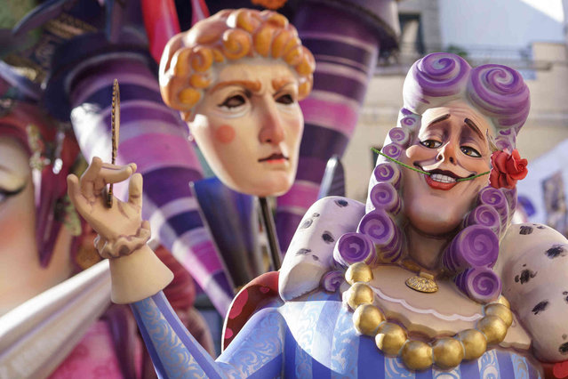 A Fallas figure shows President of Spain Pedro Sanchez, caricatured as Cinderella, during the Fallas Festival in Valencia, Spain, Thursday, March 16, 2023. Fallas are gigantic cardboard structures that satirically depict current events and personalities. More than 800 fallas compete for the prize for the most beautiful, funniest and most satirical. They will be burned on March 19, in honor of the patron saint of the Valencian Community, San José. (Photo by Alberto Saiz/AP Photo)