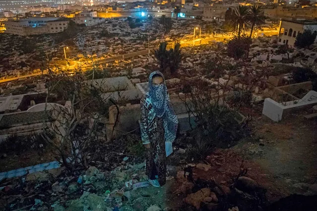A Moroccan addict stands in a cemetery overlooking Tetouan, a common spot for addicts, in the Moroccan city of M'diq on September 14, 2019. In Morocco, known worldwide for its hashish produced in the Rif mountains, heroin use is a relatively recent development that is growing exponentially, according to experts. The sale and consumption of heroin are strictly prohibited in Morocco. (Photo by Fadel Senna/AFP Photo)