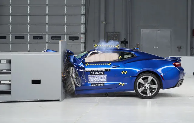 This March 24, 2016, photo provided by the Insurance Institute for Highway Safety shows a 2016 Chevrolet Camaro during a crash test at the IIHS Vehicle Research Center in Ruckersville, Va. The Ford Mustang, Chevrolet Camaro and Dodge Challenger didn't get the highest ratings in new tests by the IIHS. (Photo by Insurance Institute for Highway Safety via AP Photo)