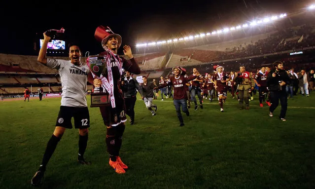 Football Soccer, San Lorenzo vs Lanus, Argentine First Division Final Match, Antonio Liberti stadium, Buenos Aires, Argentina on May 29, 2016. Lanus players celebrate with the trophy. (Photo by Marcos Brindicci/Reuters)