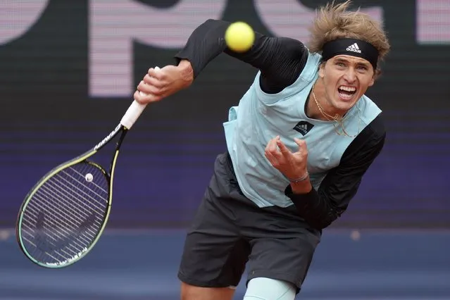 Alexander Zverev of Germany serves the ball during his first round match against Holger Rune of Denmark at the Tennis ATP tournament in Munich, Germany, Wednesday, April 27, 2022. (Photo by Matthias Schrader/AP Photo)