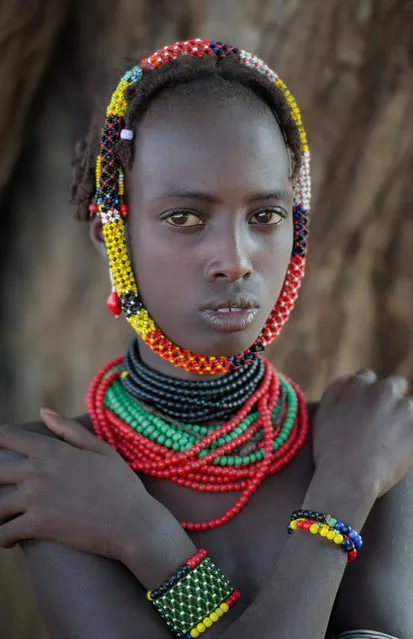 “Dreams”. Very pleasant girl from Desanache tribe. There is a wish to think that in her life everything will be good. Photo location: Omo Valley, Ephiopia. (Photo and caption by Victor Chistov/National Geographic Photo Contest)