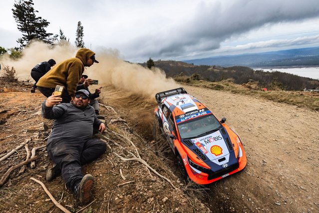 A spectator takes a selfie during the 2024 World Rally Car championship in Concepción, Chile on September 28, 2024. (Photo by Nikos Katikis/DPPI/Rex Features/Shutterstock)