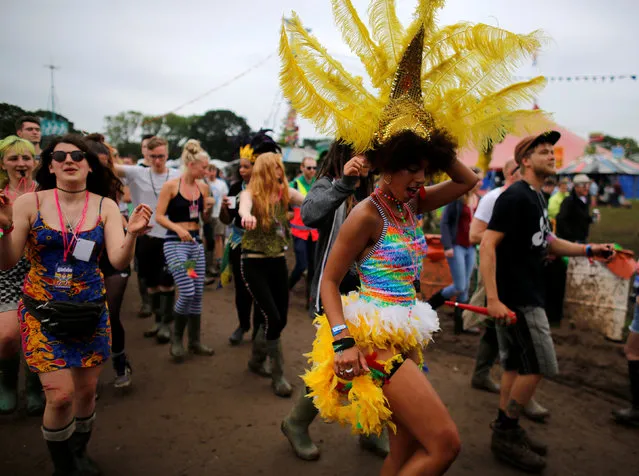 Revellers dance during the Glastonbury Festival at Worthy Farm in Somerset, Britain June 23, 2016. (Photo by Stoyan Nenov/Reuters)