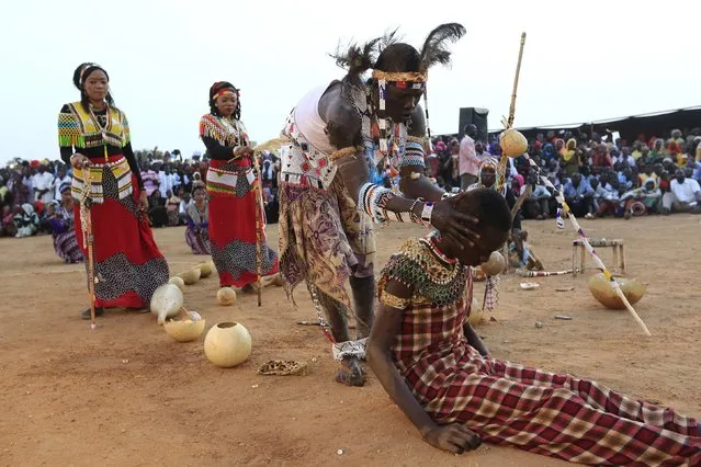 A spiritual healer from the Nuba Mountains tribe performs during a celebration of their cultural heritage, as part of ongoing events to commemorate the International Day of the World's Indigenous Peoples, in Omdurman August 15, 2015. The International Day of the World's Indigenous Peoples is observed on August 9 annually. (Photo by Mohamed Nureldin Abdallah/Reuters)
