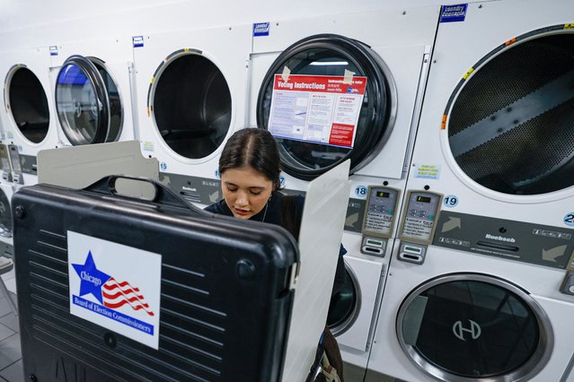A women cast her ballots Election Day at a polling location inside the Su Nueva Lavanderia in Chicago, Illinois, on November 5, 2024. (Photo by Kamil Krzaczynski/AFP Photo)