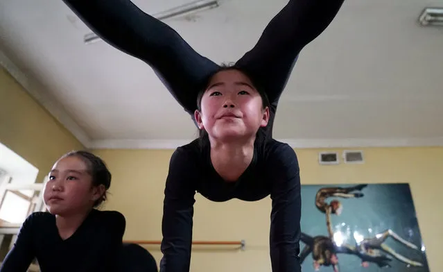 Young contortionists practice at a training school in Ulaanbaatar, Mongolia, July 4, 2016. (Photo by Natalie Thomas/Reuters)