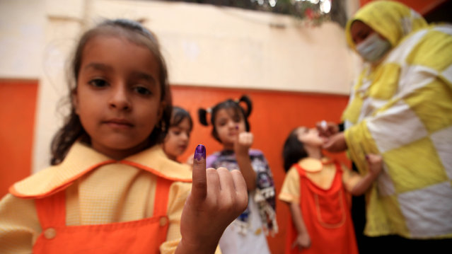 Children show their marked fingers after they received the polio vaccine drops during a door-to-door vaccination campaign in Peshawar, Pakistan, 28 October 2024. Pakistan has commenced a nationwide anti-polio campaign from 28 October to 03 November, aiming to vaccinate 45 million children under five years old across 71 affected districts. This initiative, which includes an additional dose of vitamin A to enhance immunity, marks the country's third national campaign this year in response to 41 polio cases reported, predominantly in Balochistan and Sindh. Prime minister Shehbaz Sharif has highlighted the urgency of eradicating polio, calling it a 'collective responsibility' and emphasizing the need for unity in making Pakistan polio-free, as the disease remains endemic only in Pakistan and Afghanistan. (Photo by Bilawal Arbab/EPA)