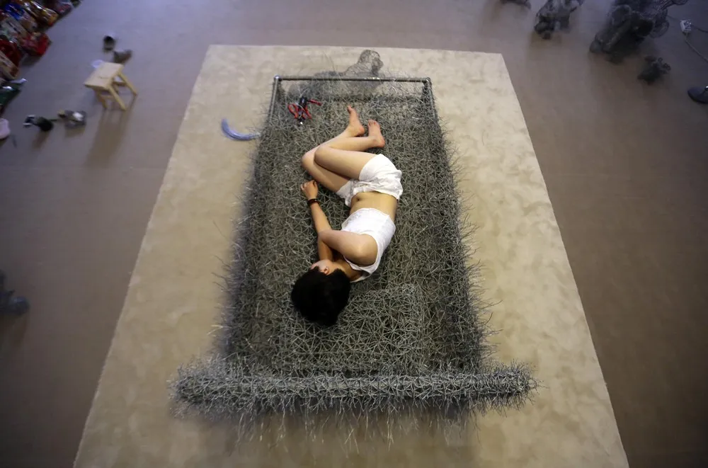 Chinese Artist Sleeps on a Iron Wire Bed
