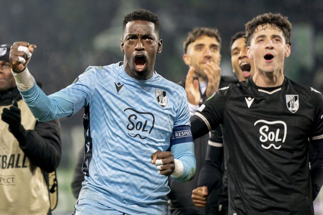 Goalkeeper Bruno Varela (L) and Manuel Silva of Vitoria Guimaraes celebrate after the UEFA Conference League soccer match between Switzerland's FC St. Gallen and Portugal's Vitoria Guimaraes, at the Kybunpark Stadium in St. Gallen, Switzerland, 12 December 2024. (Photo by Til Buergy/EPA)