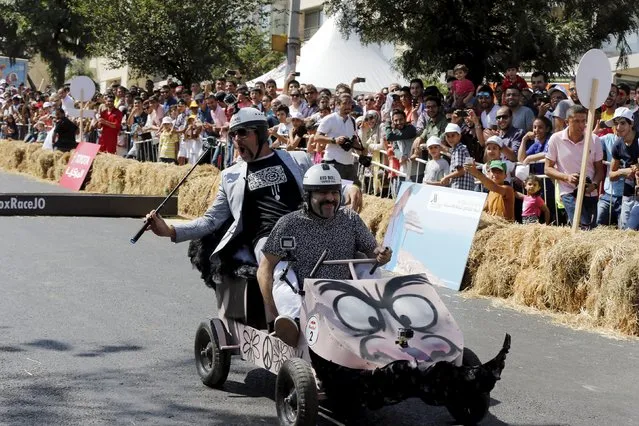 Competitors ride a homemade vehicle without an engine on a 300-metre-track during the Red Bull Soapbox Race in Amman, Jordan September 4, 2015. (Photo by Muhammad Hamed/Reuters)