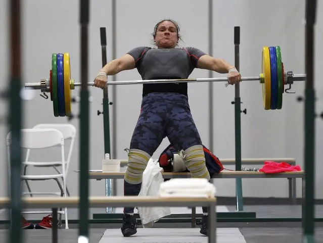 2016 Rio Olympics, Copacabana on July 29, 2016. A weightlifter from Chile practices. (Photo by Athit Perawongmetha/Reuters)