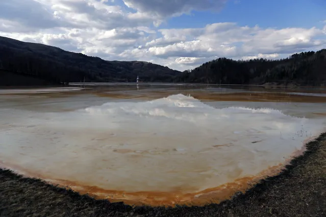 A polluted lake, tainted with cyanide and other chemicals, covers Geamana village near Rosia Montana, central Romania, March 24, 2014. (Photo by Bogdan Cristel/Reuters)