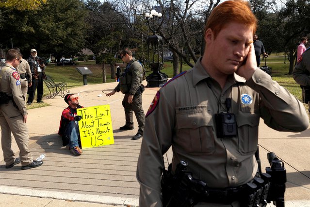 Texas state troopers detain TeramBo Jesuda during a demonstration against the Trump administration on National Day of Protest on Presidents' Day in Austin, Texas, U.S., February 17, 2025. (Photo by Nuri Vallbona/Reuters)