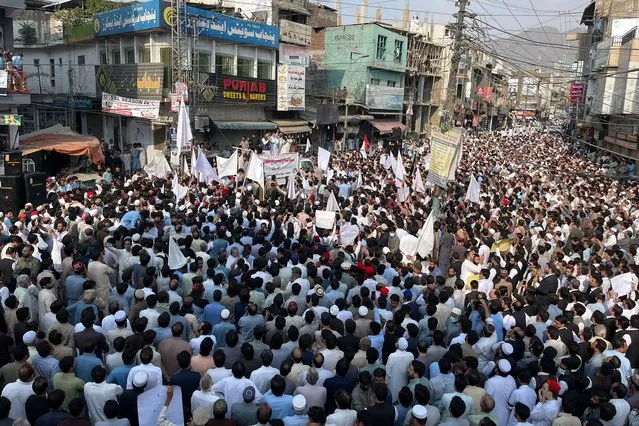Residents take part in a protest a day after an attack on a school bus in Mingora on October 11, 2022. More than 5,000 people blocked a main road through Mingora, sparked by the latest attack on a school bus on October 10, in which the driver was killed and a 10 or 11 year-old boy wounded. (Photo by AFP Photo/Stringer)