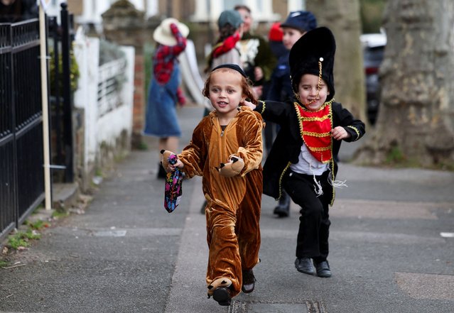 Orthodox Jewish children dressed in costumes celebrate the annual holiday of Purim in London, Britain on March 14, 2025. (Photo by Isabel Infantes/Reuters)