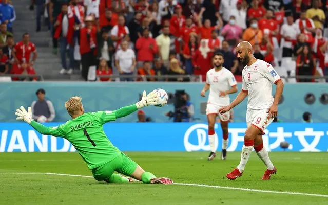 Goalkeeper Kasper Schmeichel of Denmark and Issam Jebali of Tunisia battle for the ball during the FIFA World Cup Qatar 2022 Group D match between Denmark and Tunisia at Education City Stadium on November 22, 2022 in Al Rayyan, Qatar. (Photo by Kai Pfaffenbach/Reuters)