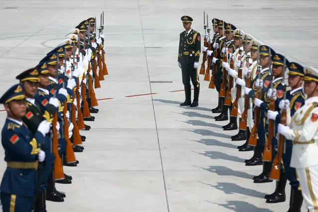 Honour guards stand at attention at the Hangzhou Xiaoshan international airport as leaders arrive for the G20 Summit in Hangzhou, Zhejiang province, China, September 3, 2016. (Photo by Damir Sagolj/Reuters)