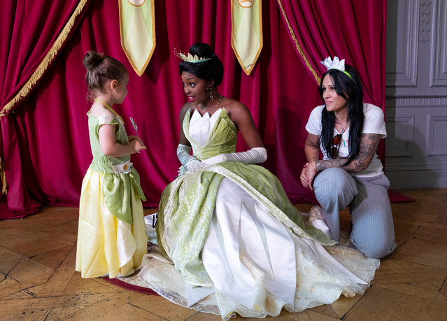 Maddie Summerfield, three, meets her favourite Disney character, Tiana, at the fifth annual A Disney Wish UK event, an immersive Make-a-Wish experience for children living with serious illnesses, at Hoar Cross Hall in Staffordshire on May 15, 2025. (Photo by Fabio De Paola/PA Wire Press Association)