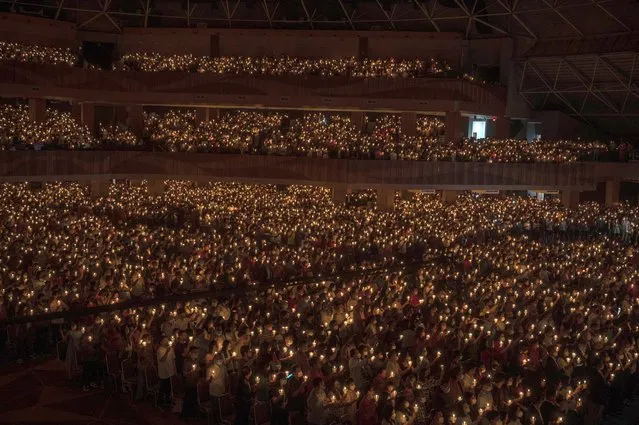 Christian devotees gather at a Bethany church for the Christmas mass in Surabaya on December 25, 2022. (Photo by Juni Kriswanto/AFP Photo)