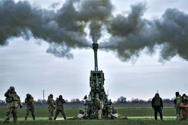 Ukrainian soldiers fire at Russian positions from a U.S.-supplied M777 howitzer in Kherson region, Ukraine, January 9, 2023. (Photo by Libkos/AP Photo)