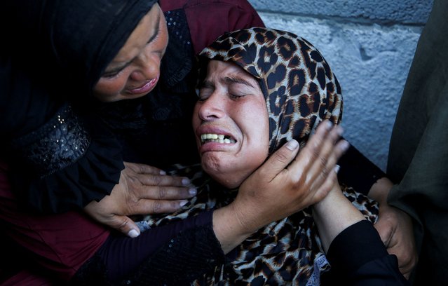 Mourners react during the funeral of Palestinians killed overnight in Israeli attacks on tents, according to Gaza's health ministry, at Nasser Hospital in Khan Younis, southern Gaza Strip, on July 9, 2025. (Photo by Hatem Khaled/Reuters)