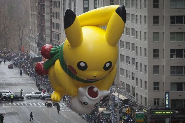 The Pikachu float makes its way down 6th Ave during the Macy's Thanksgiving Day Parade in New York November 27, 2014. (Photo by Carlo Allegri/Reuters)