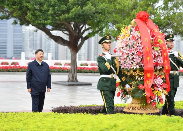 Chinese President Xi Jinping, also general secretary of the Communist Party of China Central Committee and chairman of the Central Military Commission, presents a flower basket to the statue of Comrade Deng Xiaoping at Lianhuashan Park in Shenzhen, south China's Guangdong Province, October 14, 2020. Xi attended a grand gathering held to celebrate the 40th anniversary of the establishment of the Shenzhen Special Economic Zone and delivered an important speech on Wednesday. (Photo by Chine Nouvelle/SIPA Press/Rex Features/Shutterstock)