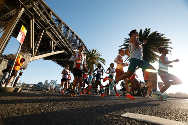 Runners pass under the Sydney Harbour Bridge during the 2025 Sydney Marathon on August 31, 2025 in Sydney, Australia. (Photo by Darrian Traynor/Getty Images)