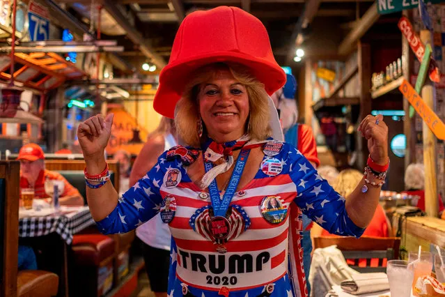 A woman poses for a photo during an election night watch party organized by a group called “Villagers for Trump” in The Villages, Florida, on November 3, 2020. (Photo by Ricardo Arduengo/AFP Photo)