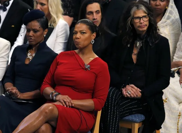Singer Steven Tyler (R) of Aerosmith and Dana Elaine Owens (2nd L), better known by her stage name Queen Latifah, attend the Nobel Peace Prize awards ceremony at the City Hall in Oslo December 10, 2014. Pakistani teenager Malala Yousafzai, who was shot in the head by the Taliban in 2012 for advocating girls' right to education, has won the prize along with Indian campaigner against child trafficking and labor, Kailash Satyarthi. (Photo by Suzanne Plunkett/Reuters)