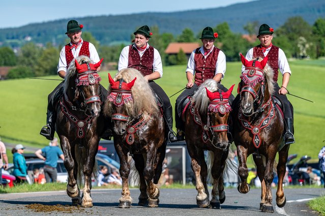 Participants in the Kötztinger Pfingstritt on May 20, 2024 ride their horses during a pilgrimage from Bad Kötzting to St Nicholas’s Church in Steinbühl, about seven kilometres away. The procession is one of Bavaria’s oldest events. (Photo by Armin Weigel/Avalon)