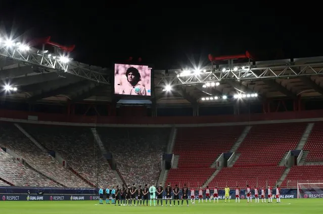 A minute's silence is held in memory of Diego Maradona before the Champions League match between Olympiacos and Manchester City in Piraeus, Greece, November 25, 2020. (Photo by Alkis Konstantinidis/Reuters)