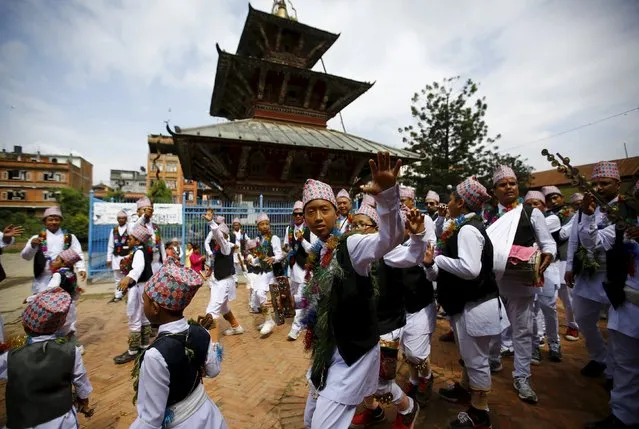 Devotees in traditional attire dance as they take part in a parade commemorating the Neku Jatra-Mataya festival, the Festival of Lights, in Lalitpur, Nepal August 31, 2015. (Photo by Navesh Chitrakar/Reuters)