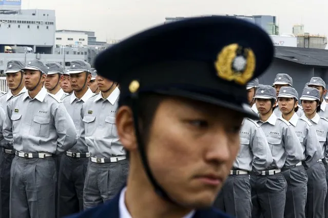 Members of the Tokyo fire brigade stand in formation during a New Year presentation in Tokyo January 6, 2015. (Photo by Thomas Peter/Reuters)