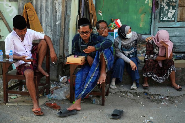 Family members of students wait as rescue works are underway for victims trapped under the rubble after a building under construction collapsed at an Islamic boarding school in Sidoarjo, East Java, Indonesia, Thursday, October 2, 2025. (Photo by Achmad Ibrahim/AP Photo)