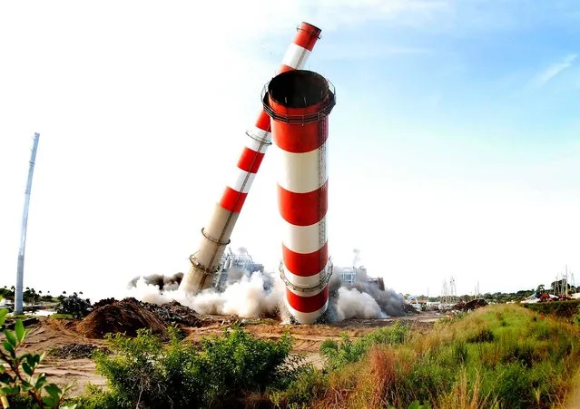 The 400 foot tall stacks and boilers at FPL's Cape Canaveral power plant go down in Cocoa to make way for a new clean energy center that will open at the site in 2013. (Photo by Doug Murray/Associated Press/Florida Power & Light Company)