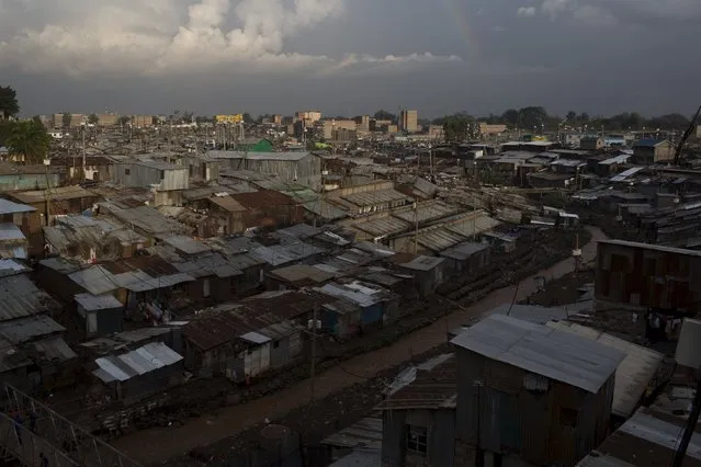 A rainbow appears above Mathare in Nairobi, Kenya, November 17, 2015. (Photo by Siegfried Modola/Reuters)