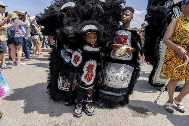 Members of Big Chief Dow & the Timbuktu Warriors and Cheyenne Mardi Gras Indians perform at the 2023 New Orleans Jazz and Heritage Festival on Thursday, May 4, 2023, at the Fair Grounds Race Course in New Orleans. (Photo by Amy Harris/Invision/AP Photo)