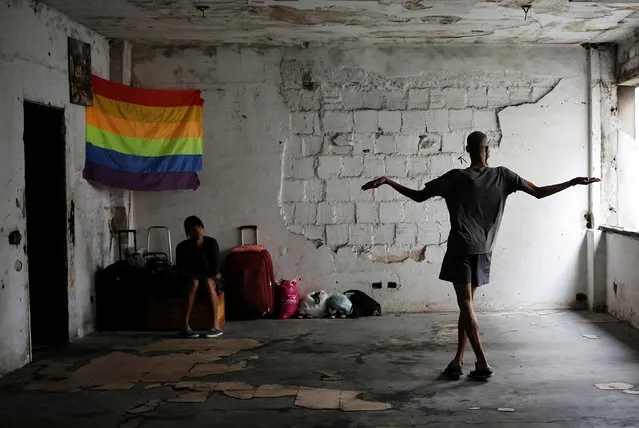 Members of Brazil's Movimento dos Sem-Teto (Roofless Movement) and the lesbian, gay, bisexual and transgender (LGBT) community, are pictured in a vacant apartment during the occupation of an empty building in downtown Sao Paulo, Brazil, November 3, 2016. (Photo by Nacho Doce/Reuters)