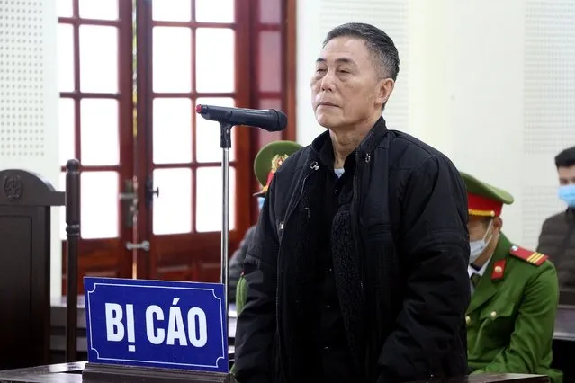 This picture taken and released by the Vietnam News Agency on December 15, 2020 shows Vietnamese writer Tran Duc Thach during his court trial in Vietnam's Nghe An province, as he was sentenced to 12 years in jail on charges of attempting to overthrow the government. (Photo by Vietnam News Agency/AFP Photo)