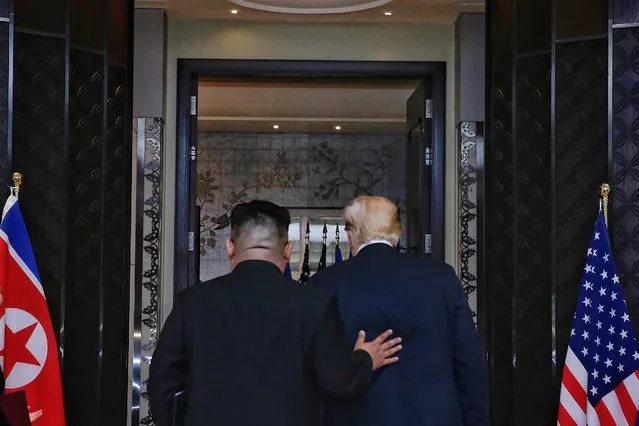 US President Donald J. Trump (R) and North Korean Chairmain Kim Jong-un (L) depart after a signing ceremony during their historic DPRK-US summit, at the Capella Hotel on Sentosa Island, Singapore, 12 June 2018. The summit marks the first meeting between an incumbent US President and a North Korean leader. (Photo by Kevin Lim/EPA/EFE/The Straits Times)