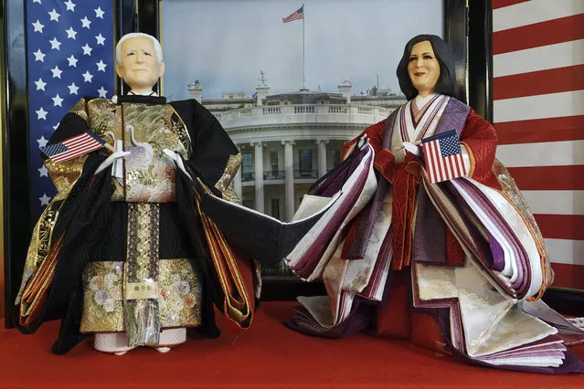 “Hina” dolls depicting U.S. President Joe Biden and Vice President Kamala Harris, right, are displayed for Girls' Day celebrations at Kyugetsu, a Japanese traditional doll company, Wednesday, January 27, 2021 in Tokyo. The dolls are among others adorned with images based on persons of the year. March 3 is celebrated as Girls' Day to pray for the vigorous growth of girls in the family. (Photo by Eugene Hoshiko/AP Photo)