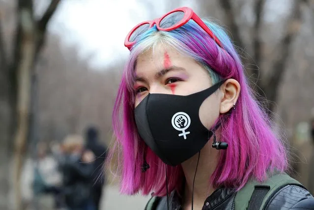 A demonstrator takes part in a march to mark International Women's Day in Almaty, Kazakhstan on March 8, 2021. (Photo by Pavel Mikheyev/Reuters)