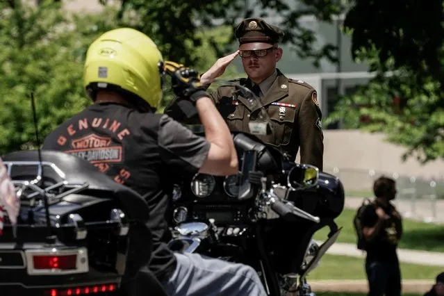 A man in uniform salutes as the “Rolling to Remember” motorcycle rally, successor to “Rolling Thunder” rides through Washington to bring attention to issues faced by veterans, in Washington, U.S., May 29, 2022. (Photo by Ken Cedeno/Reuters)