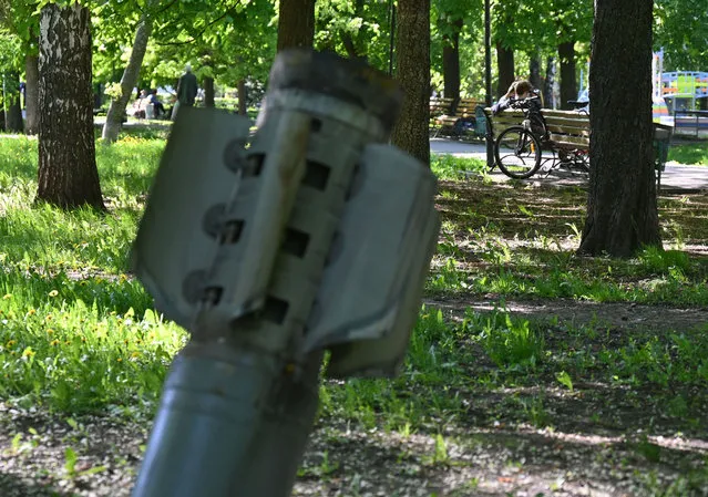 A missile fragment is seen in a park in Chuguiv, Kharkiv region, on May 5, 2022, amid Russian invasion of Ukraine. (Photo by Sergey Bobok/AFP Photo)